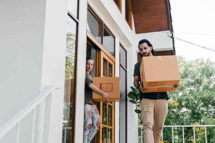 Moving House Tips | Own Home Style | people carrying sturdy, labelled boxes