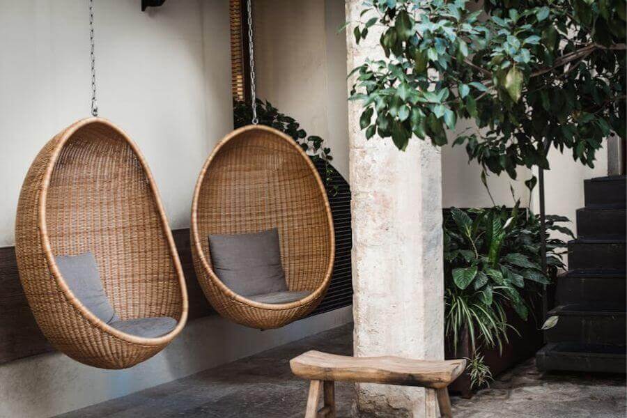 Outdoor seating ideas | two hanging egg seats on patio | OwnHomeStyle